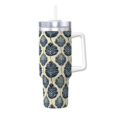 Tumbler with leaf pattern and handle on a white background