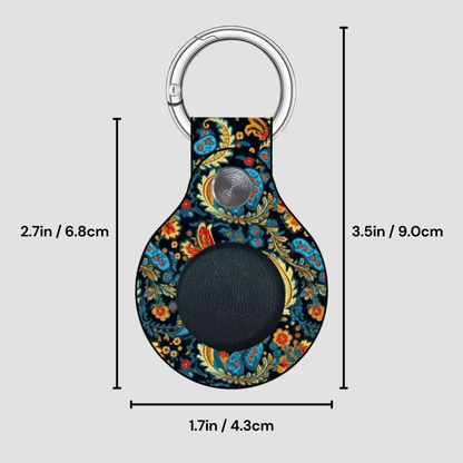 Decorative keychain with paisley pattern and measurements on a gray background