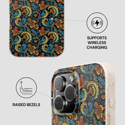 Phone case with paisley pattern, wireless charging symbol, and raised bezels text on a light gray background.