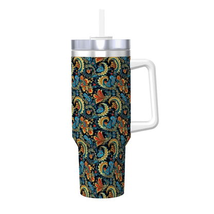 Tumbler with floral pattern and handle on a white background