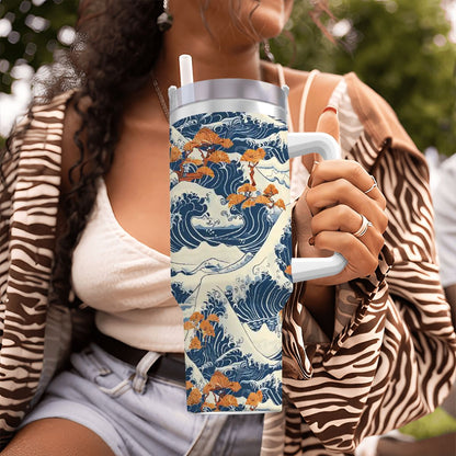 Person holding a tumbler with a wave design in an outdoor setting