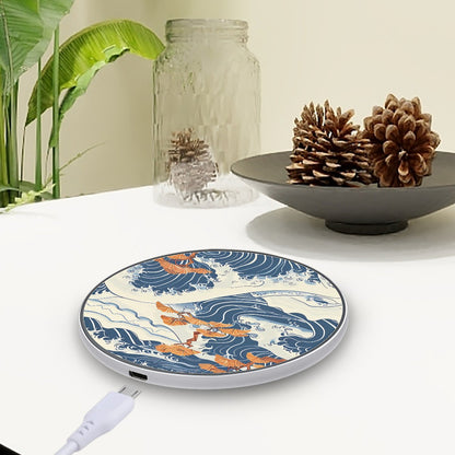 Wireless charger with wave and dragon design on a table with decorative items. | Casenari