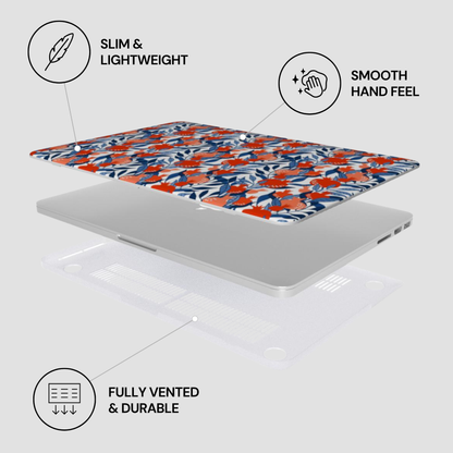 Laptop with floral design case on a white background, featuring text labels about features.