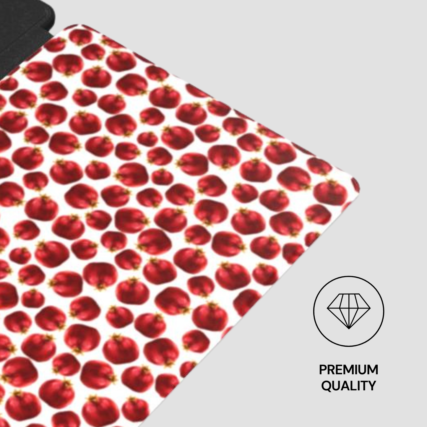 Red pomegranate patterned mat with 'Premium Quality' label on a gray background