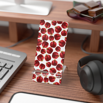 Phone case with red apple pattern on a desk with keyboard and headphones