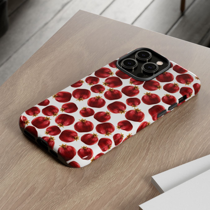 Phone case with red apple pattern on a wooden surface