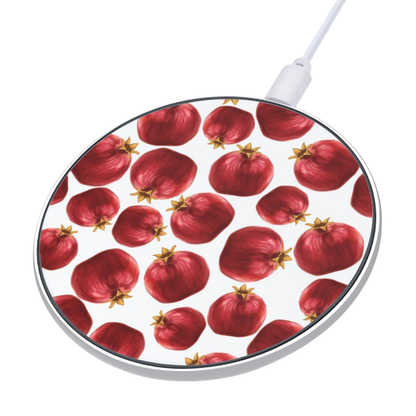 Round wireless charging pad with pomegranate pattern on a white background