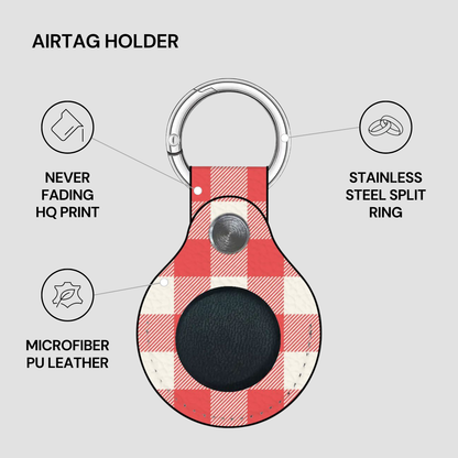 An airtag holder keychain with a red and white plaid pattern, featuring a black circular magnetic area on the front, a silver metal split ring, and a silver snap button. The image includes text callouts highlighting features like 'NEVER FADING HQ PRINT', 'STAINLESS STEEL SPLIT RING', and 'MICROFIBER PU LEATHER' on a light gray background.