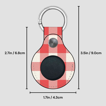 A red and white buffalo plaid keychain tag with a black circular center and a silver metal key ring, shown with dimension lines and measurements on a light gray background.