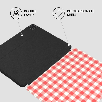 Black folio-style tablet case with a red-and-white gingham patterned back cover, shown on a light gray background with callout graphics reading 'DOUBLE LAYER' and 'POLYCARBONATE SHELL'.