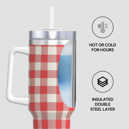A handled insulated tumbler with a red and white gingham pattern, shown on a light gray background with feature callouts: a temperature icon reading 'HOT OR COLD FOR HOURS' and a double steel layer icon reading 'INSULATED DOUBLE STEEL LAYER'.