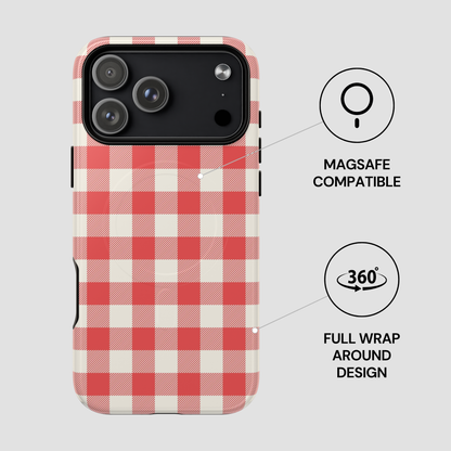 A phone case with a red and cream gingham check pattern, shown on a light gray background with two black feature callouts reading 'MAGSAFE COMPATIBLE' and 'FULL WRAP AROUND DESIGN'.