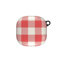A protective wireless earbud charging case cover featuring a red and white buffalo plaid pattern, with a small black loop on the top right.