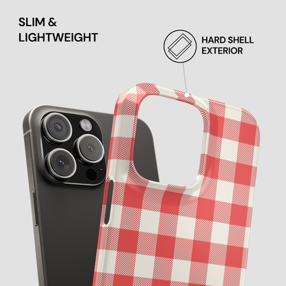 A red and white checkered phone case shown in front of a black smartphone on a light gray background, with text reading 'SLIM & LIGHTWEIGHT' and 'HARD SHELL EXTERIOR' plus a small icon.