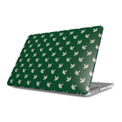 Laptop with a green case featuring white bird pattern on a white background