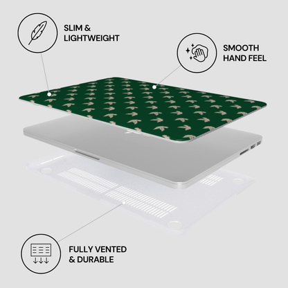 Laptop with green patterned skin on a light gray background, featuring text labels about features.