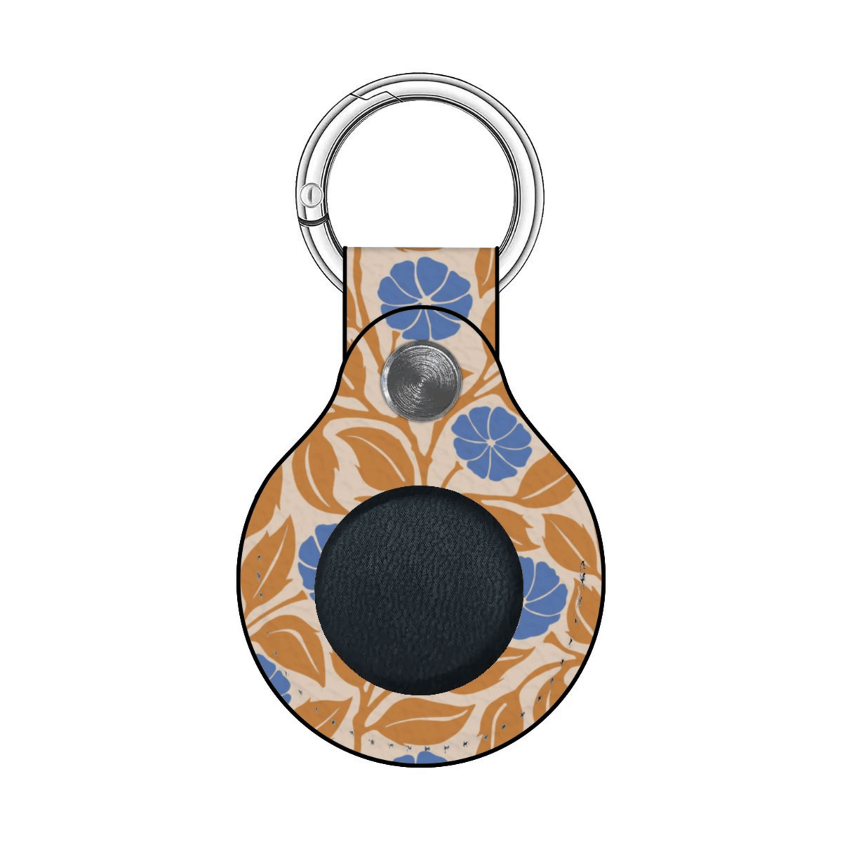 A teardrop-shaped leather keychain or bag charm with a floral pattern in orange and blue on a cream background, featuring a black circular patch in the center and a silver metal key ring.