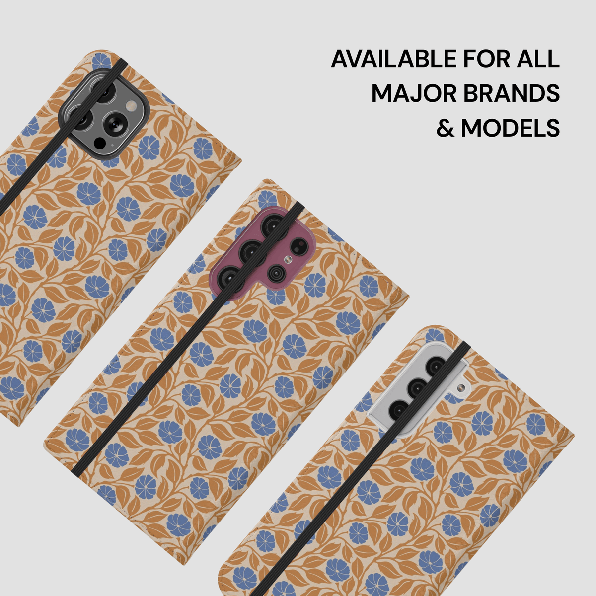 Three smartphone cases with a tan and blue floral pattern are shown on phones against a light gray background, with text reading 'AVAILABLE FOR ALL MAJOR BRANDS & MODELS'.