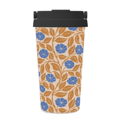 A travel tumbler with a black lid, featuring a cream background with a repeating pattern of blue flowers and orange-brown leaves.