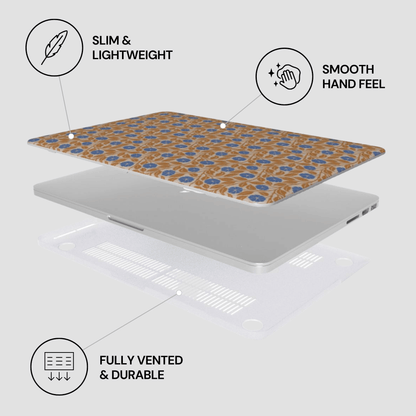 Laptop with a patterned cover on a light gray background, featuring text labels about the product's features.