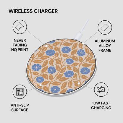 A wireless charger with a beige background and a blue and brown floral pattern, surrounded by text callouts highlighting features like never fading HQ print, aluminum alloy frame, anti-slip surface, and 10W fast charging.