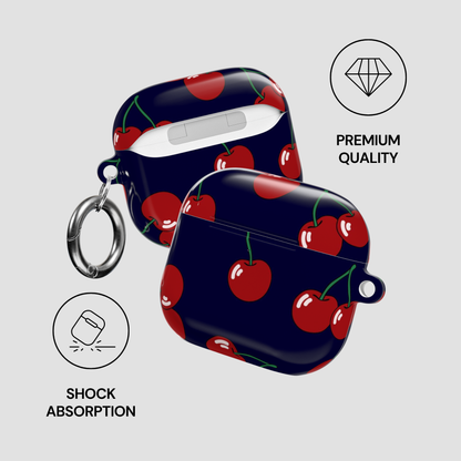 Navy blue case with red cherry pattern on a gray background