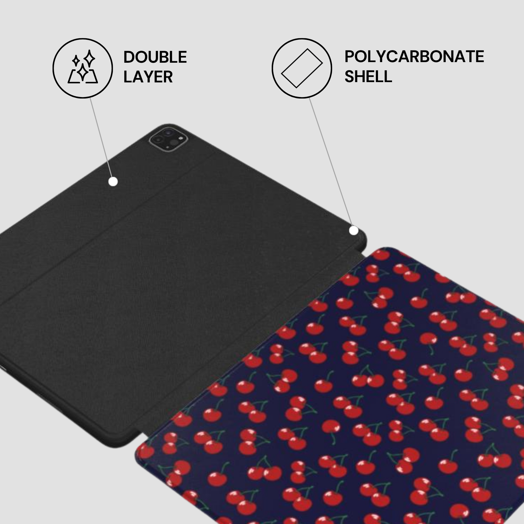 Tablet case with cherry pattern and text labels indicating double layer and polycarbonate shell.