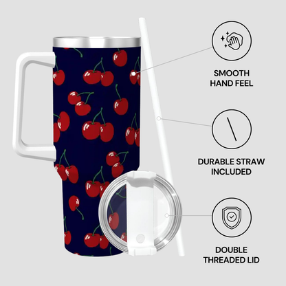Travel mug with cherry pattern, lid, and straw on a gray background
