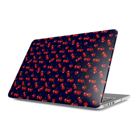 Laptop with red cherry pattern on a dark blue background