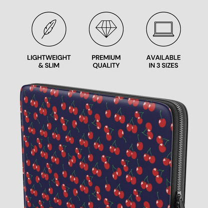 Laptop sleeve with cherry pattern and product features on a light gray background