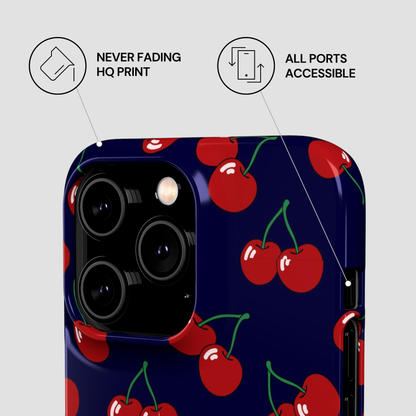 Phone case with cherry pattern on a blue background, featuring text about print quality and port accessibility.