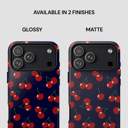 Two phone cases with cherry pattern, one glossy and one matte, on a white background.