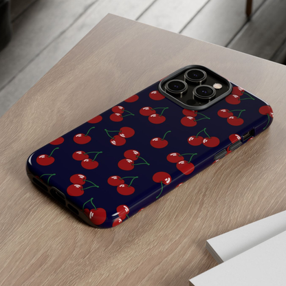 Phone case with cherry pattern on a wooden surface