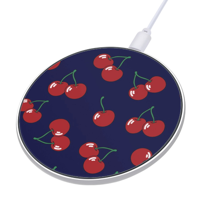 Wireless charging pad with cherry pattern on a blue background