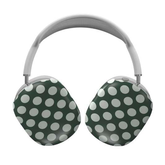 Green and white polka dot headphones on a white background