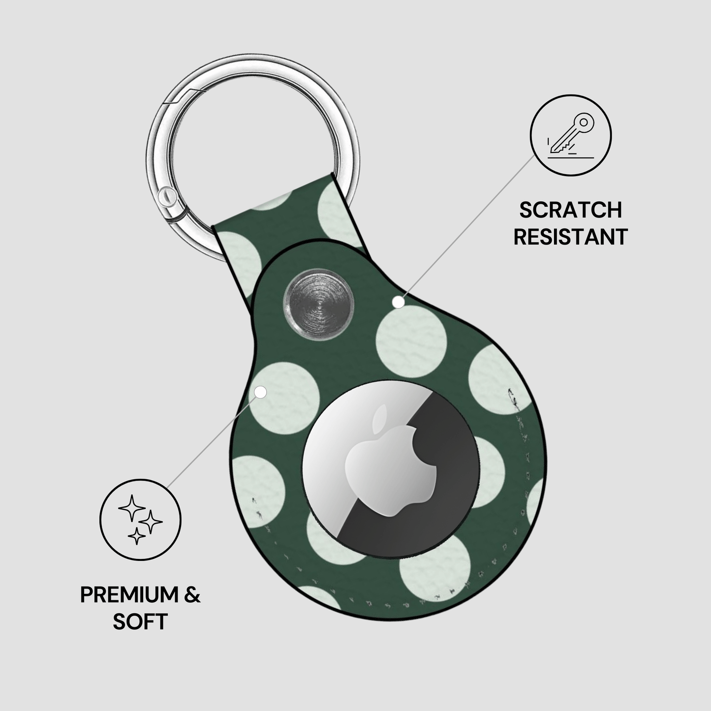 Green polka dot keychain case with Apple logo on a light gray background