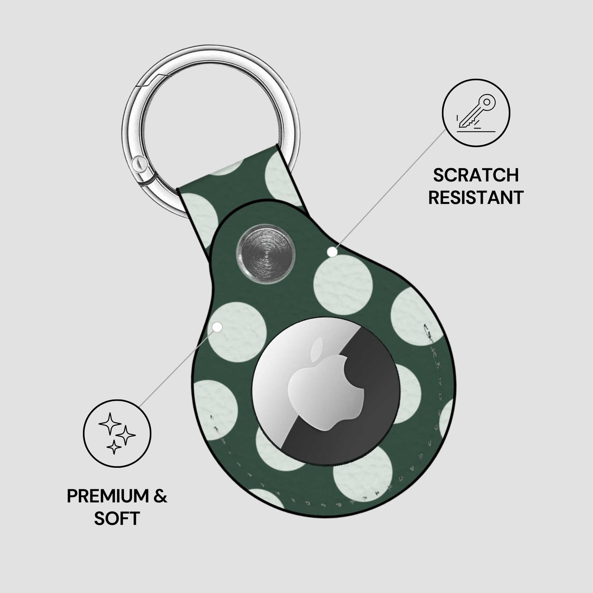 Green polka dot keychain case with Apple logo on a light gray background