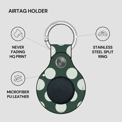 Airtag holder with green and white polka dot design on a gray background