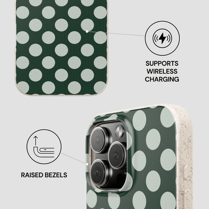 Green polka dot phone case with wireless charging and raised bezels features on a light gray background