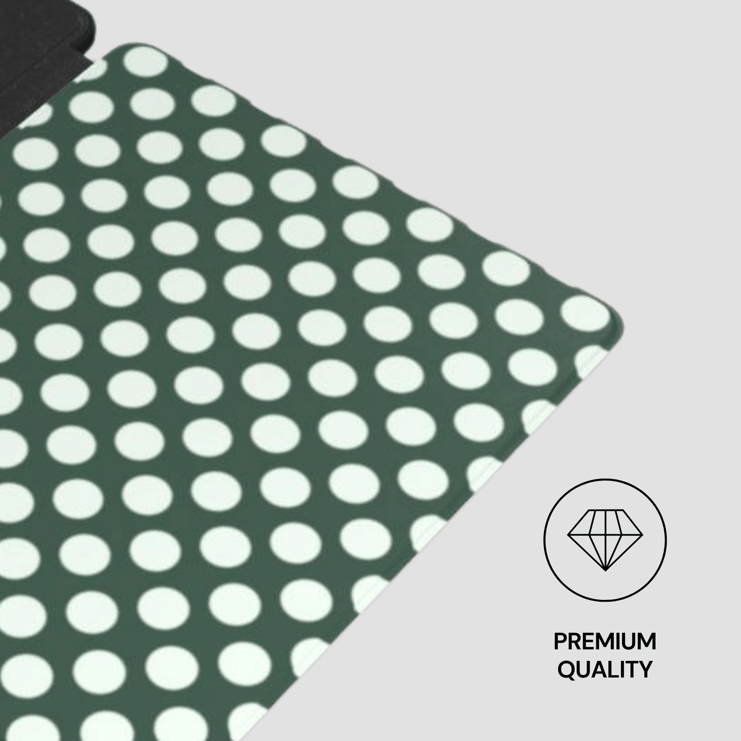 Green fabric with white polka dots on a gray background, featuring a 'Premium Quality' label.