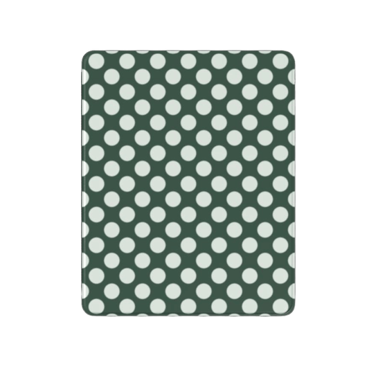 Green fabric with white polka dots on a white background
