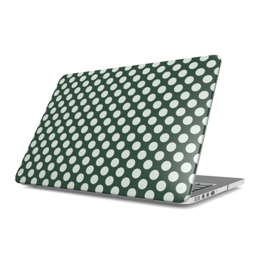Laptop with a green and white polka dot case on a white background