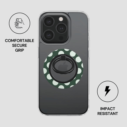Phone case with a green polka dot design and ring holder on a gray background
