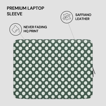 Green laptop sleeve with white polka dots on a light gray background