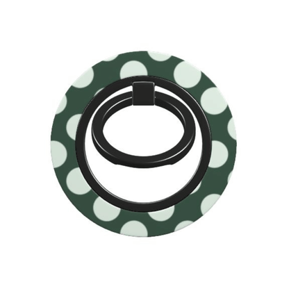 Black phone ring holder on a green and white polka dot background