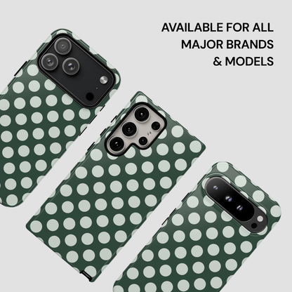 Green phone case with white polka dots on a light gray background