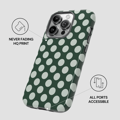 Green phone case with white polka dots on a light gray background