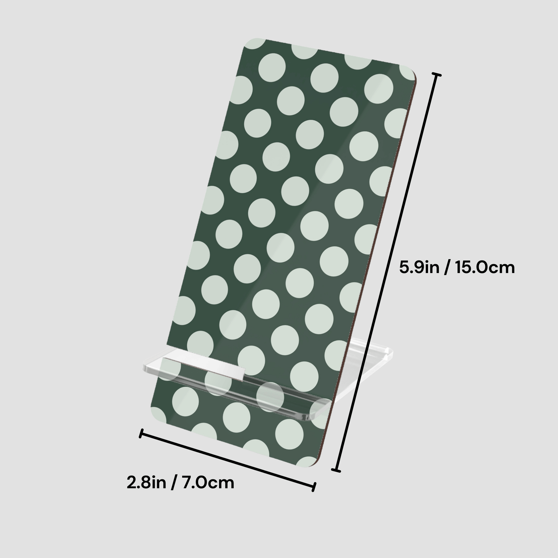 Green towel with white polka dots and measurements on a light gray background