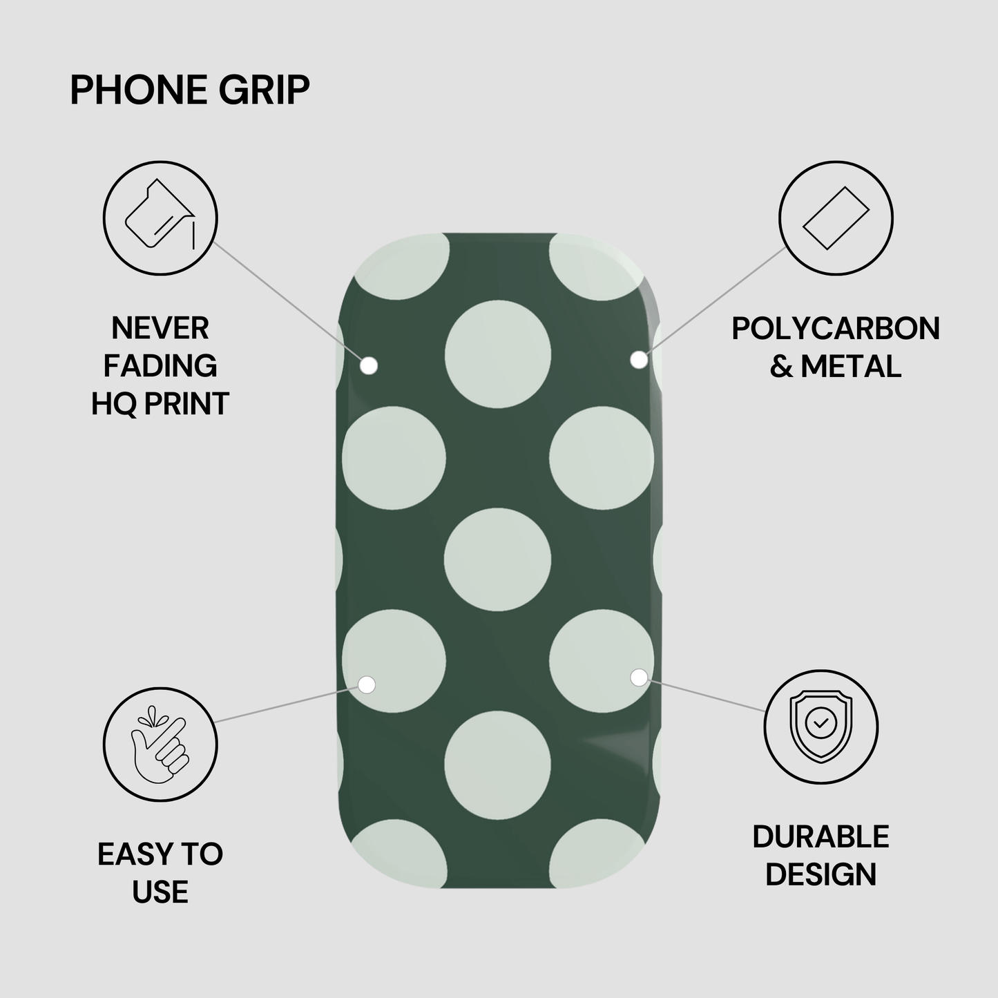 Phone grip with green and white polka dot pattern on a gray background
