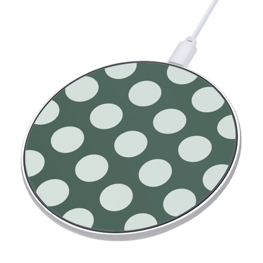 Wireless charging pad with green and white polka dot pattern on a white background